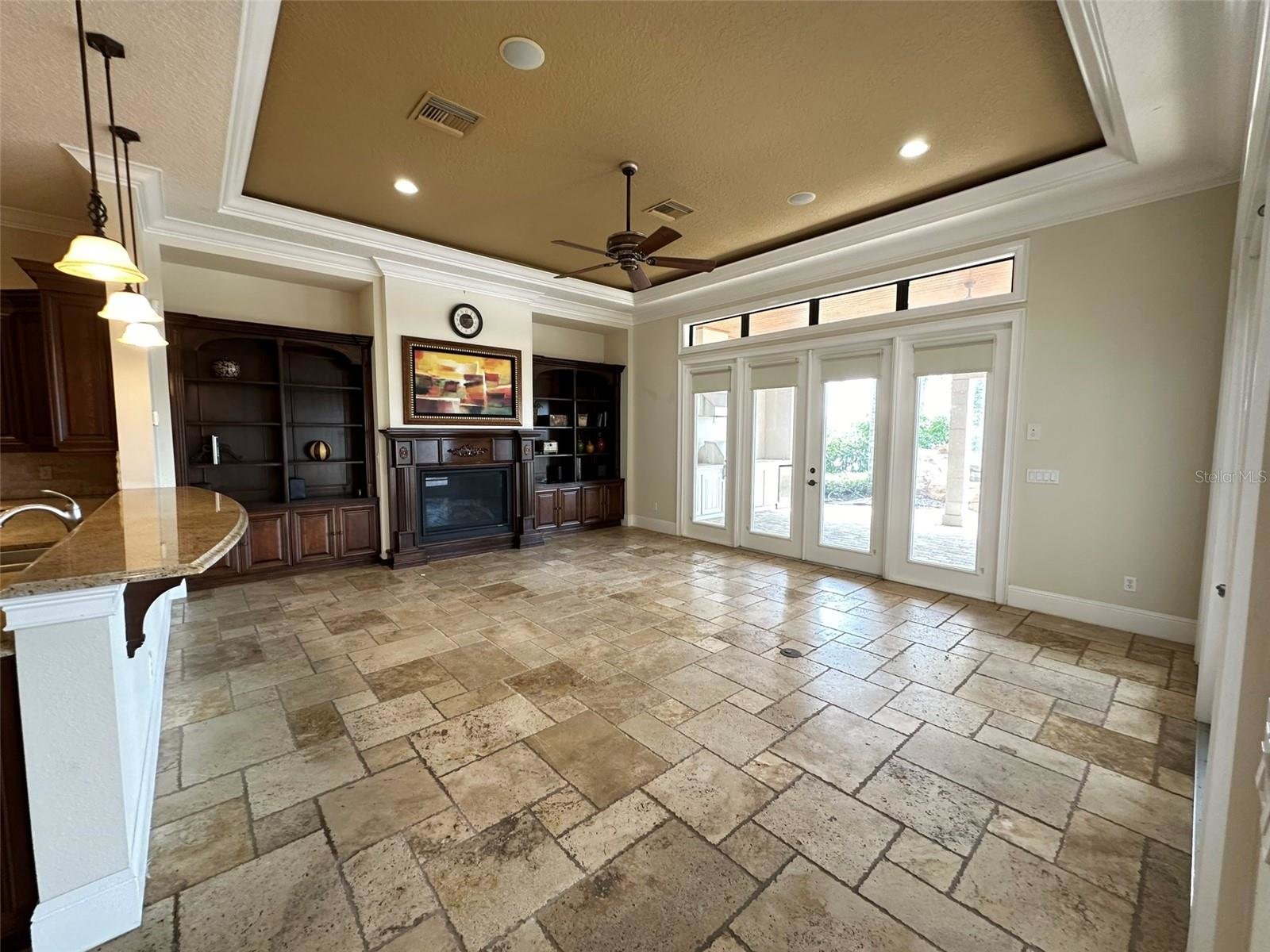 family room with tile and wooden fireplace